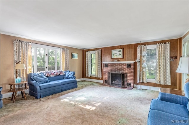 2458 Hess Rd, Newfane, NY 14008 - carpeted living area featuring ornamental molding, plenty of natural light, a fireplace, and wooden walls