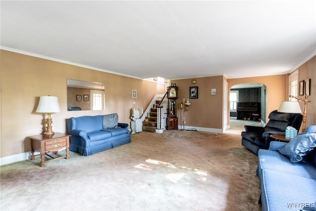 2458 Hess Rd, Newfane, NY 14008 - living room with stairs, arched walkways, crown molding, and carpet