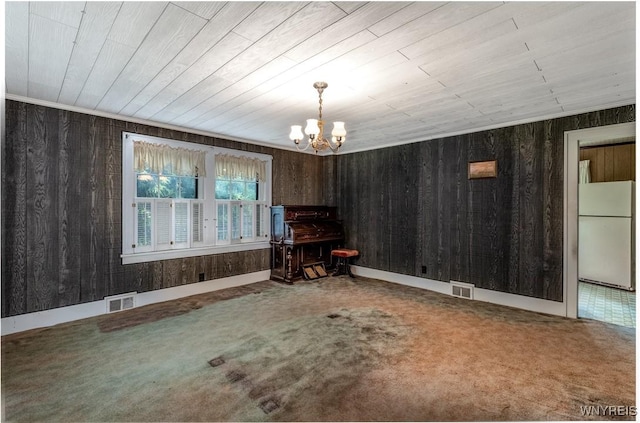2458 Hess Rd, Newfane, NY 14008 - living area featuring a chandelier, carpet flooring, and wood walls