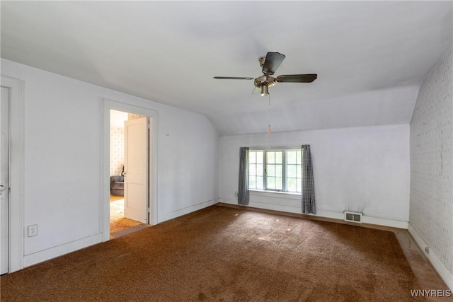 2458 Hess Rd, Newfane, NY 14008 - spare room featuring vaulted ceiling, carpet, and a ceiling fan
