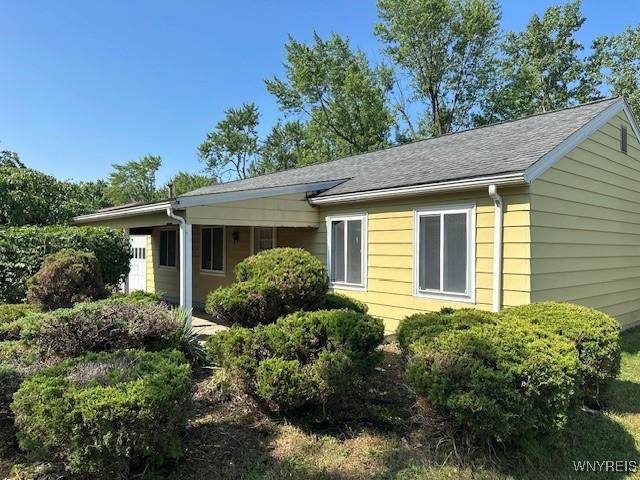 454 Campus Dr, Amherst, NY 14226 - view of side of property with a shingled roof