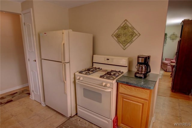 112 Vegola Ave, Cheektowaga, NY 14225 - kitchen with white appliances and dark countertops
