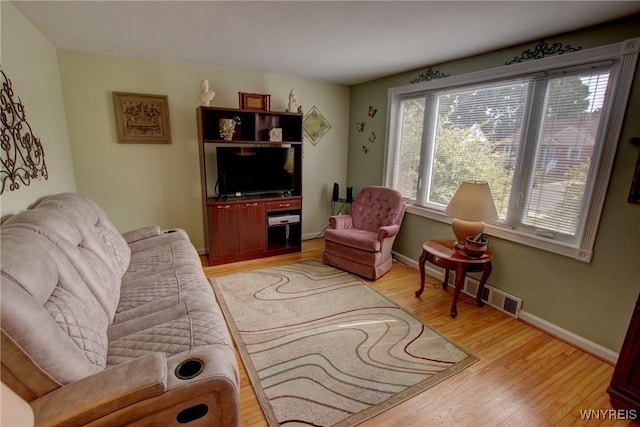 112 Vegola Ave, Cheektowaga, NY 14225 - living room with light wood-style floors and baseboards
