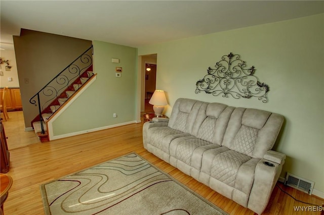 112 Vegola Ave, Cheektowaga, NY 14225 - living room featuring stairway and light wood finished floors