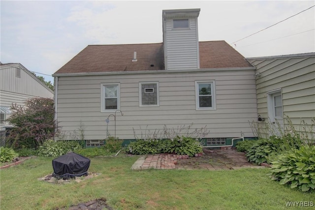 112 Vegola Ave, Cheektowaga, NY 14225 - rear view of property with a lawn and a chimney