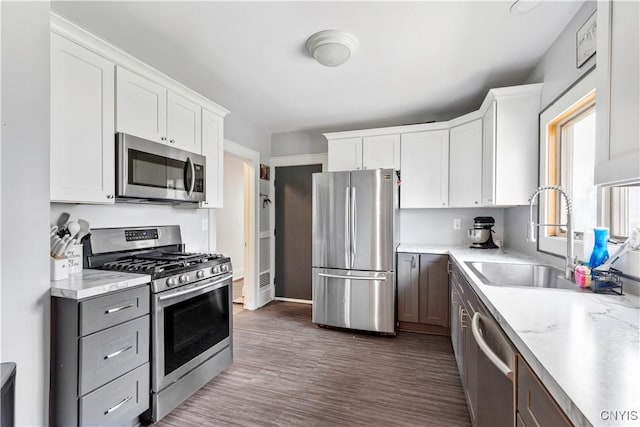 423 Highland Ave, Dewitt, NY 13057 - kitchen with appliances with stainless steel finishes, light countertops, white cabinets, and dark wood-type flooring
