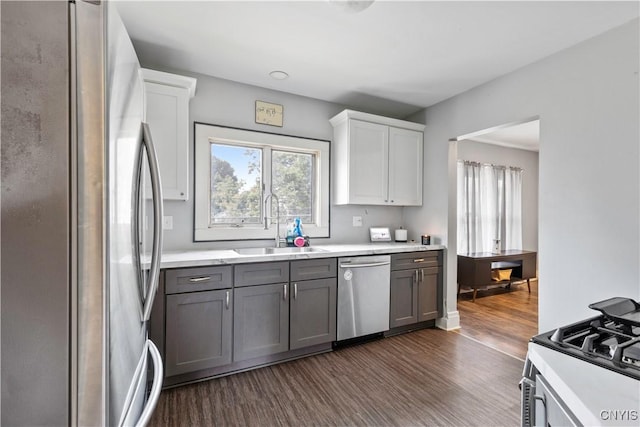 423 Highland Ave, Dewitt, NY 13057 - kitchen featuring stainless steel appliances, dark wood finished floors, light countertops, white cabinetry, and gray cabinetry