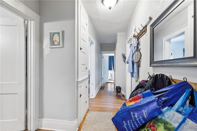 423 Highland Ave, Dewitt, NY 13057 - corridor featuring wood finished floors and baseboards