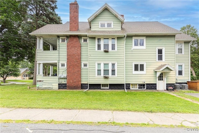 423 Highland Ave, Dewitt, NY 13057 - back of property with a chimney and a yard