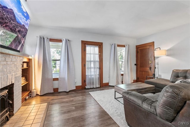 423 Highland Ave, Dewitt, NY 13057 - living room with a fireplace and wood finished floors