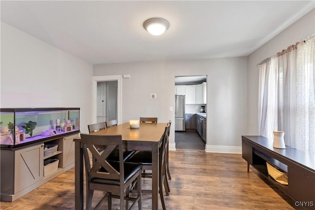423 Highland Ave, Dewitt, NY 13057 - dining space with wood finished floors and baseboards
