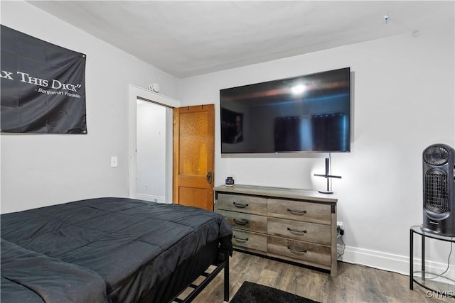 423 Highland Ave, Dewitt, NY 13057 - bedroom featuring dark wood-type flooring and baseboards