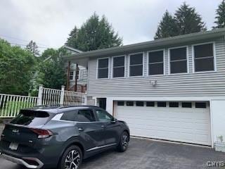 884 Kibby Rd, Lysander, NY 13027 - view of property exterior featuring an attached garage and driveway