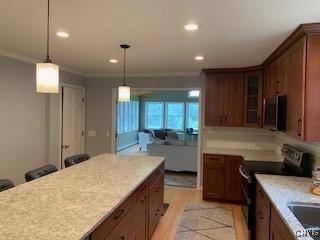 884 Kibby Rd, Lysander, NY 13027 - kitchen featuring black range with electric cooktop, stainless steel microwave, glass insert cabinets, recessed lighting, and ornamental molding