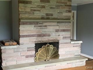 884 Kibby Rd, Lysander, NY 13027 - detailed view of a brick fireplace and crown molding