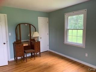 884 Kibby Rd, Lysander, NY 13027 - bedroom with multiple windows and wood finished floors