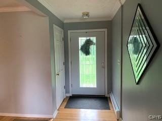 884 Kibby Rd, Lysander, NY 13027 - doorway with plenty of natural light, light wood-style flooring, and crown molding
