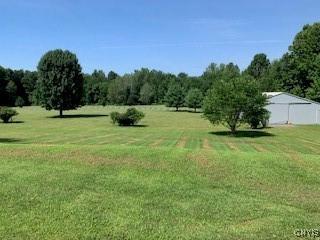 884 Kibby Rd, Lysander, NY 13027 - view of grassy yard featuring an outbuilding
