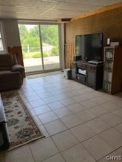 884 Kibby Rd, Lysander, NY 13027 - living room with light tile patterned floors