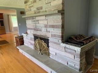 884 Kibby Rd, Lysander, NY 13027 - detailed view of a fireplace and wood finished floors