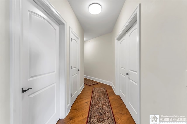 743 Legacy Dr Unit 209, Lewiston, NY 14092 - hall with light wood-style flooring and baseboards