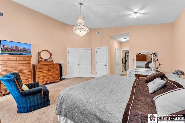743 Legacy Dr Unit 209, Lewiston, NY 14092 - carpeted bedroom featuring a chandelier and lofted ceiling