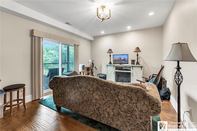 743 Legacy Dr Unit 209, Lewiston, NY 14092 - living area with wood finished floors, a glass covered fireplace, and recessed lighting