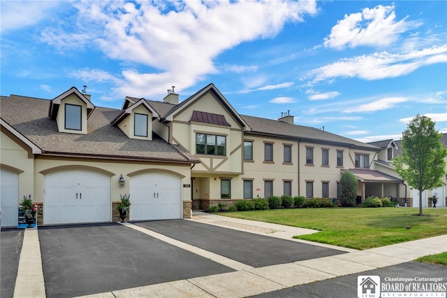743 Legacy Dr Unit 209, Lewiston, NY 14092 - english style home with stucco siding, driveway, an attached garage, and a front lawn
