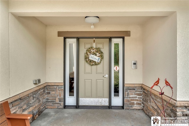 743 Legacy Dr Unit 209, Lewiston, NY 14092 - property entrance featuring stone siding and stucco siding