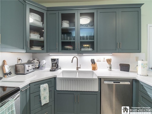 5301 E Lake Rd Unit 23, Chautauqua, NY 14728 - kitchen featuring stainless steel appliances, light countertops, and glass insert cabinets