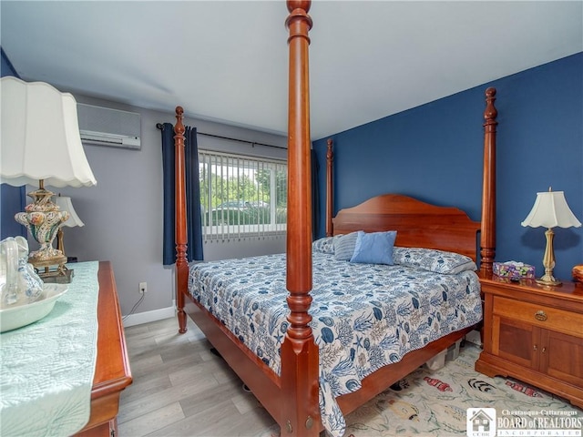 5301 E Lake Rd Unit 23, Chautauqua, NY 14728 - bedroom with wood finished floors and a wall mounted AC