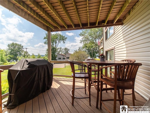 5301 E Lake Rd Unit 23, Chautauqua, NY 14728 - wooden terrace with outdoor dining area and a grill