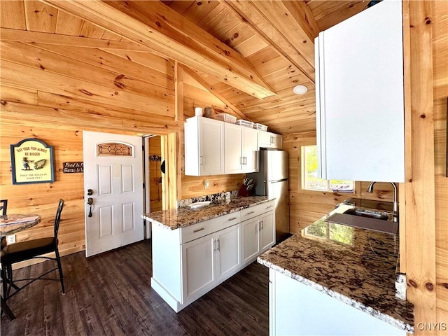 3018 Camp Rd, Eaton, NY 13334 - kitchen featuring wood ceiling, wood walls, freestanding refrigerator, dark wood finished floors, and white cabinets