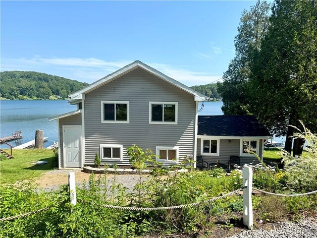 3018 Camp Rd, Eaton, NY 13334 - rear view of property with a water view and a forest view