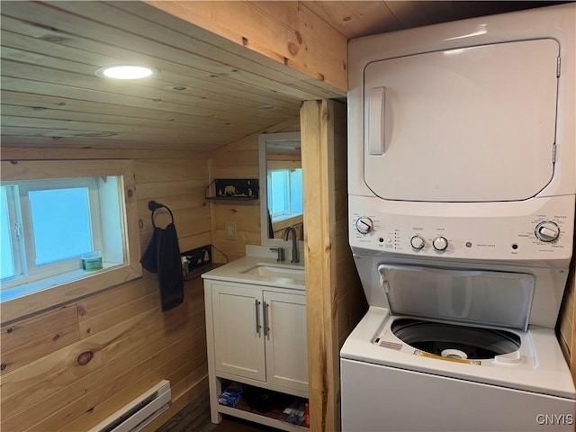 3018 Camp Rd, Eaton, NY 13334 - washroom with stacked washing machine and dryer, wooden ceiling, plenty of natural light, wood walls, and baseboard heating