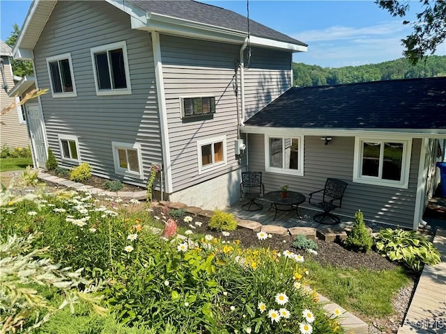 3018 Camp Rd, Eaton, NY 13334 - rear view of property featuring roof with shingles