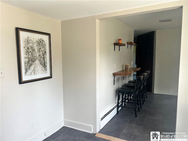 70 Williams Ave, Wellsville, NY 14895 - dining area featuring a baseboard heating unit