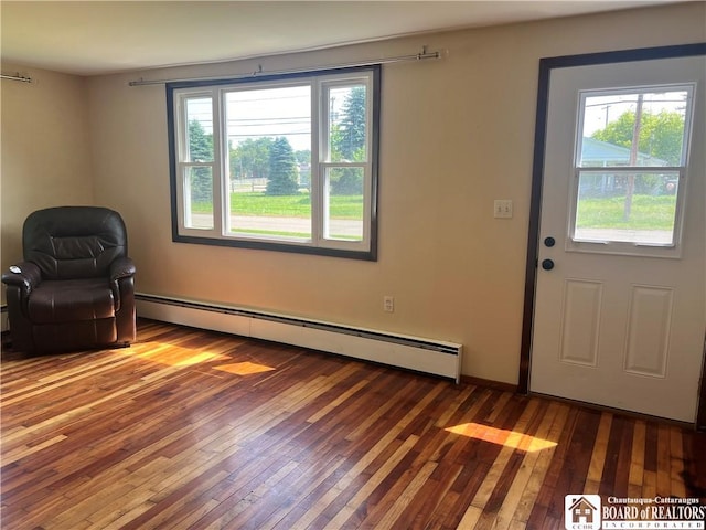 70 Williams Ave, Wellsville, NY 14895 - unfurnished room featuring hardwood / wood-style floors and a baseboard heating unit