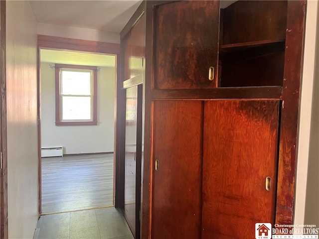 70 Williams Ave, Wellsville, NY 14895 - hall featuring a baseboard heating unit