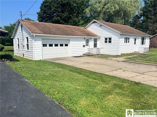 70 Williams Ave, Wellsville, NY 14895 - ranch-style house with concrete driveway, a front yard, a shingled roof, and an attached garage