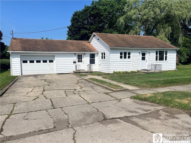 70 Williams Ave, Wellsville, NY 14895 - ranch-style home with driveway, a garage, a front lawn, and a shingled roof