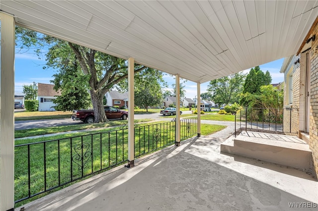 112 Southgate Rd, Cheektowaga, NY 14215 - covered porch with a residential view and a lawn