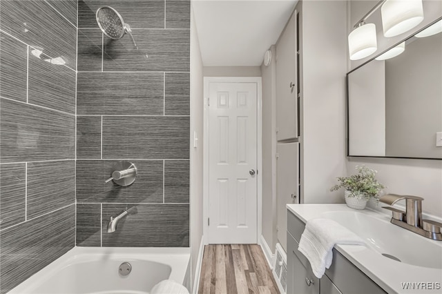 112 Southgate Rd, Cheektowaga, NY 14215 - full bath with vanity, wood finished floors, and shower / washtub combination