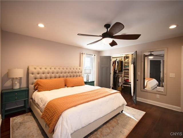 2480 Middle Rd, Oneida, NY 13421 - bedroom featuring dark wood-type flooring, recessed lighting, ceiling fan, and a walk in closet