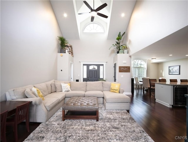 2480 Middle Rd, Oneida, NY 13421 - living area featuring wine cooler, a ceiling fan, dark wood-style floors, and a towering ceiling