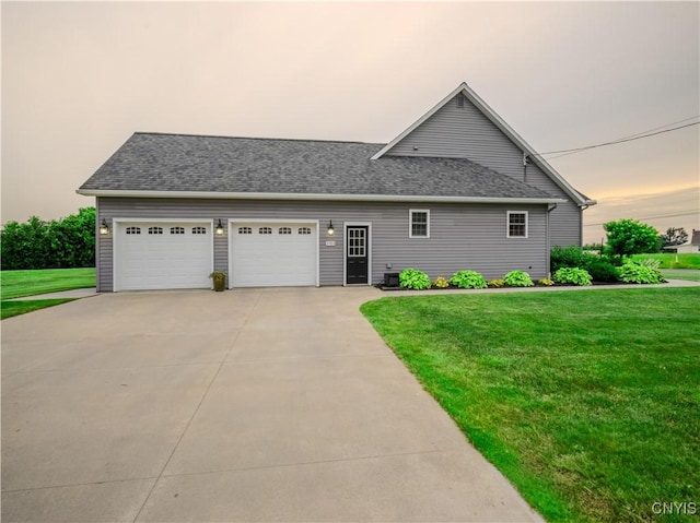 2480 Middle Rd, Oneida, NY 13421 - view of front of home with a yard, driveway, an attached garage, and a shingled roof