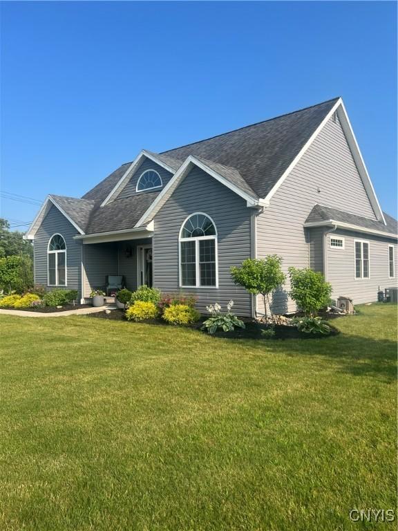 2480 Middle Rd, Oneida, NY 13421 - view of front facade with a front lawn and a shingled roof