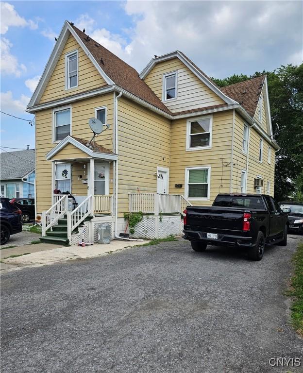 1125 Adams St, Utica, NY 13501 - traditional-style home featuring roof with shingles