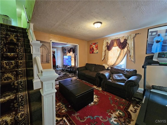 1125 Adams St, Utica, NY 13501 - carpeted living area with a textured ceiling
