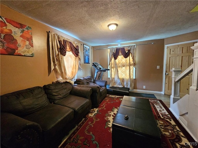 1125 Adams St, Utica, NY 13501 - living area featuring a textured ceiling